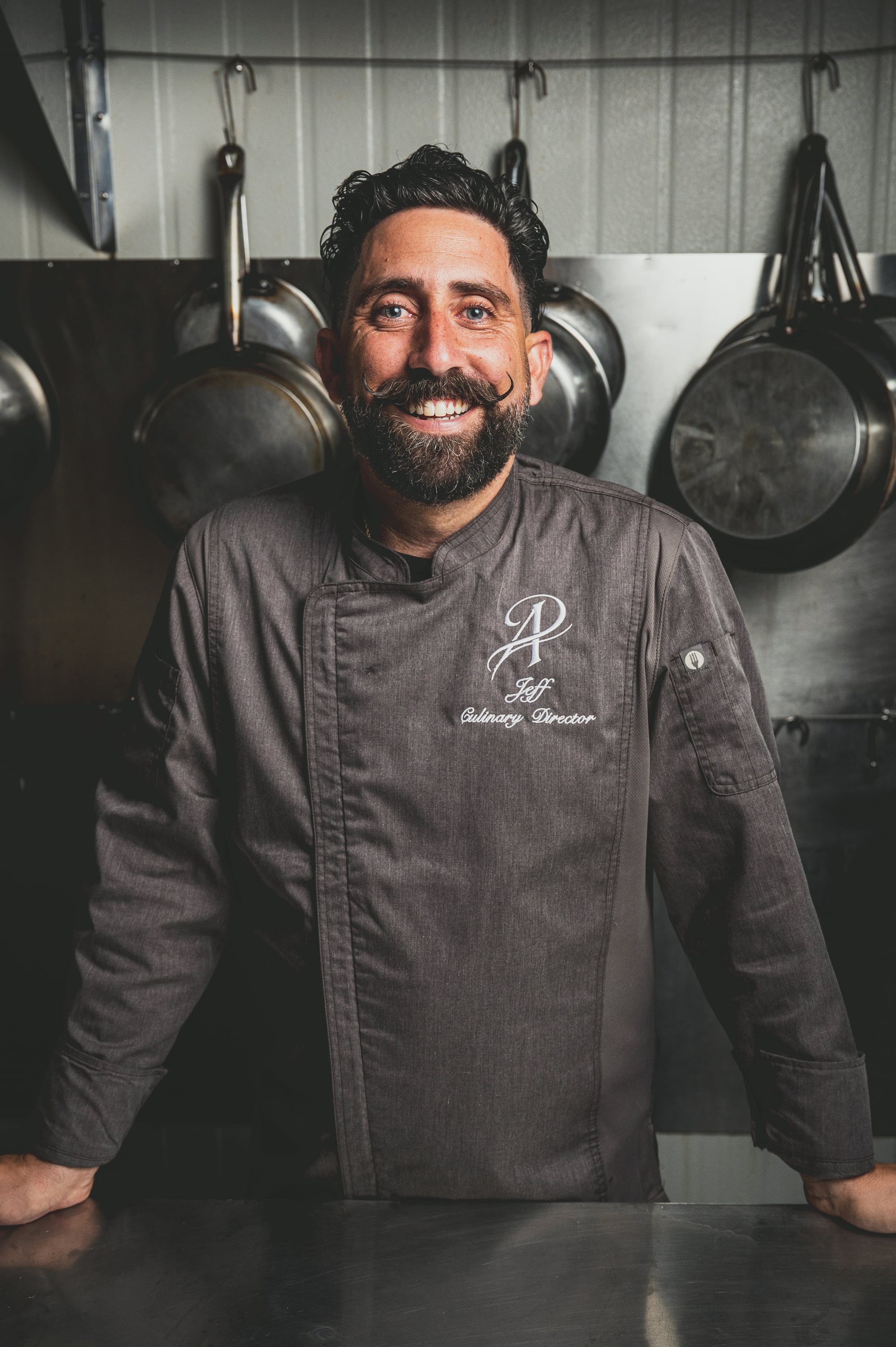 Chef Jeff Ardi smiling in the kitchen